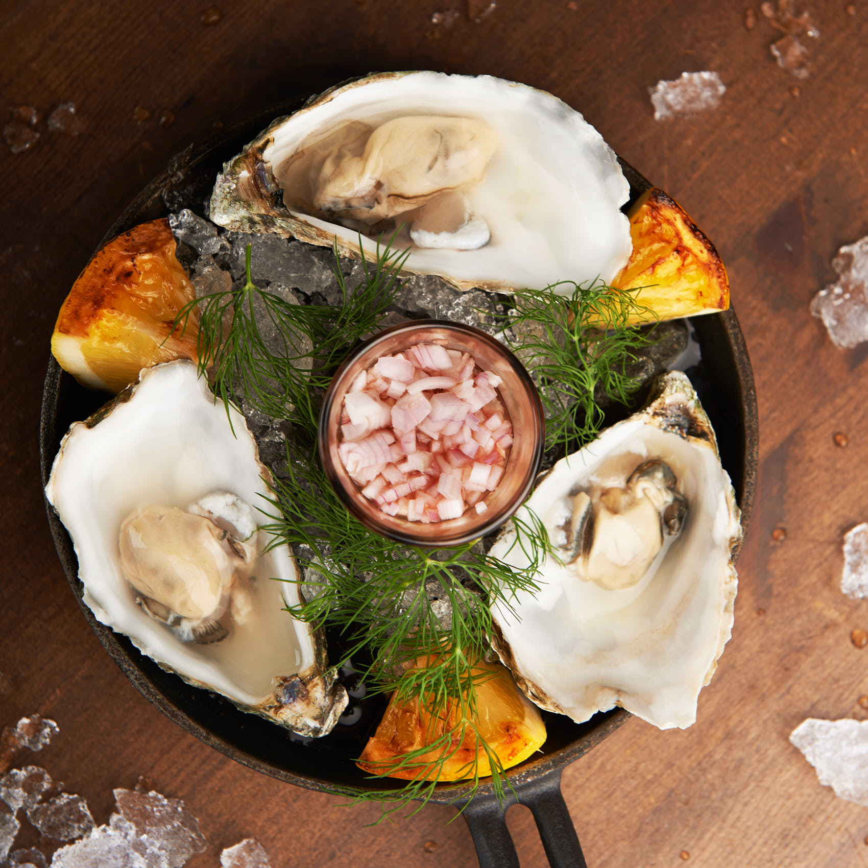 Oysters with grilled lemon and shrimps photo by Marcel Tiedje